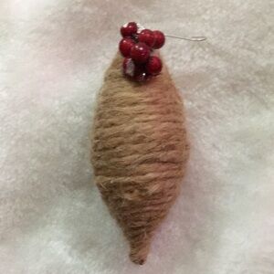 Handcrafted Tan Yarn Ornament with Red Beads